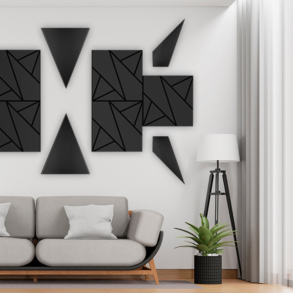 Modern living room with geometric wall art acoustic wall panels and a gray sofa.