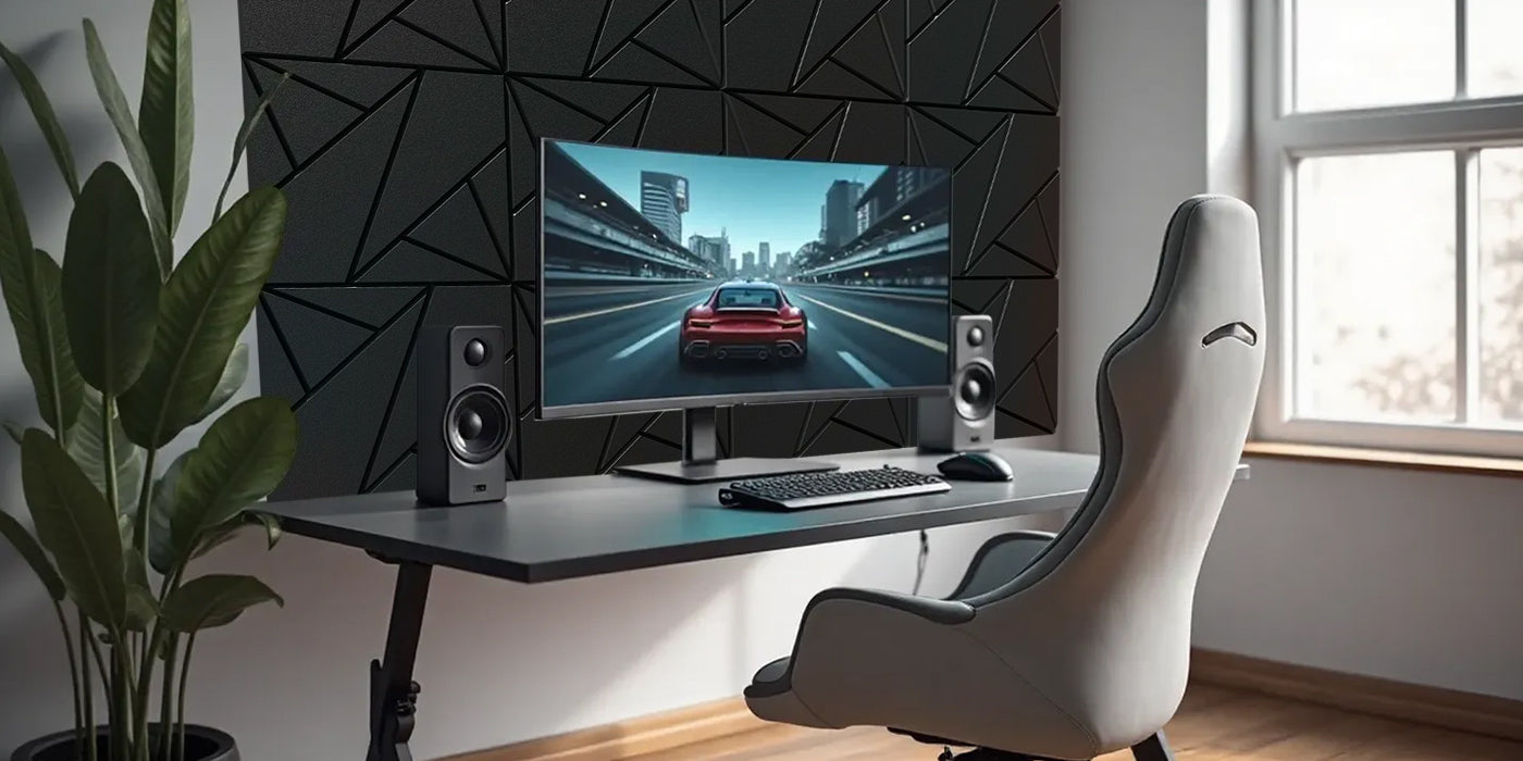 Modern home office setup with a desk, computer monitor, speakers, and chair.